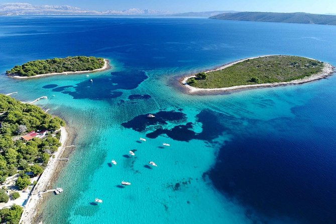 Blue Lagoon, Trogir & Čiovo catamaran tour with Food and Drinks - Blue Lagoon and Krknjasi Bay: your first swim stop from Split