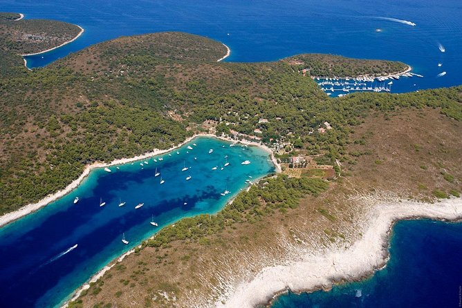 Exclusive Private Tour: Red Rocks & Pakleni Islands - Stop 1, Red Rocks on Hvar: swimming, snorkeling, and those red cliffs