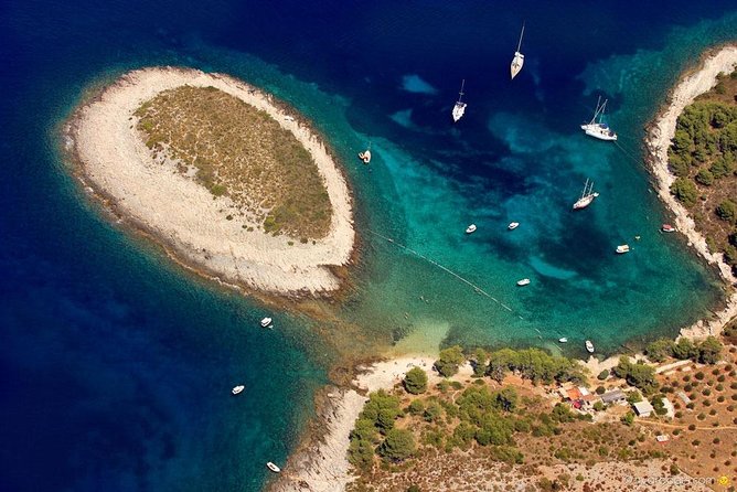 Exclusive Private Tour: Red Rocks & Pakleni Islands - Stop 2, Dubovica Beach: pebbles, stone houses, and a small underwater cave