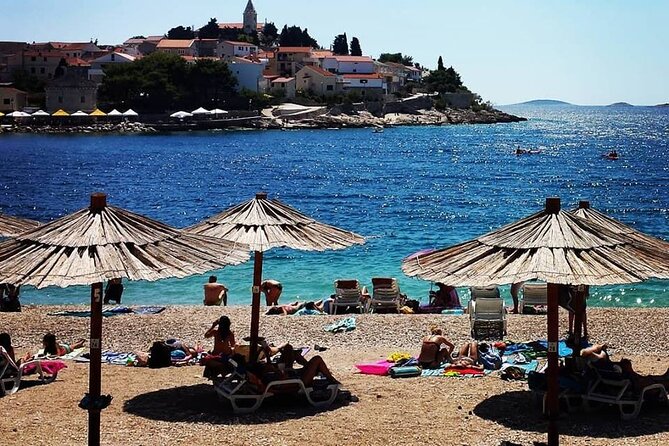 From Split or Trogir: Krka Waterfalls & Primošten Sightseeing - Primošten stop: medieval town views, real beach time, and what to do with 2 hours