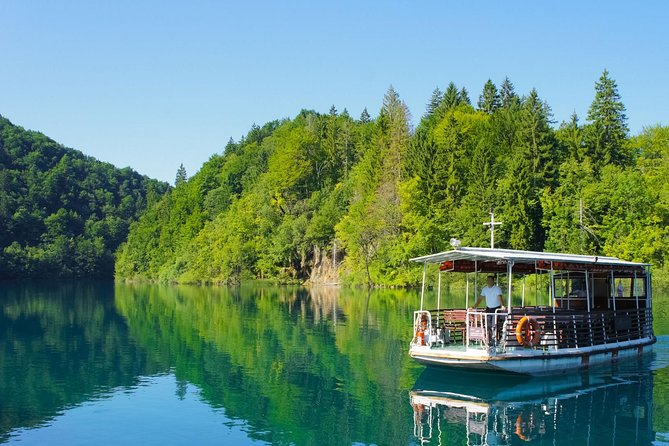 From Split: Plitvice Lakes National Park Guided Tour - When weather changes the plan, be ready for a wet day