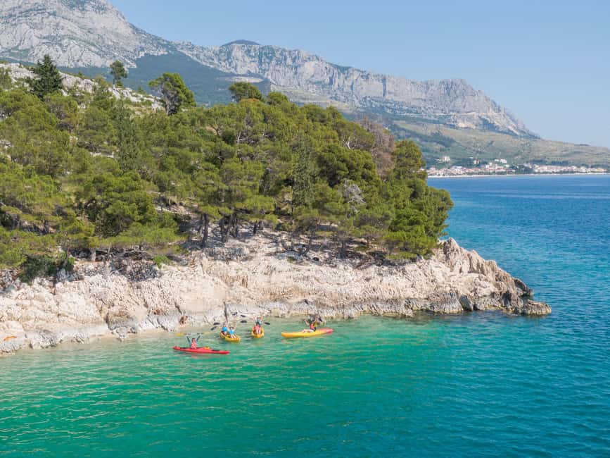 Makarska: Guided Sea Kayaking Tour with Snorkeling Stop - Entering The Kayaks From Lavander Beach