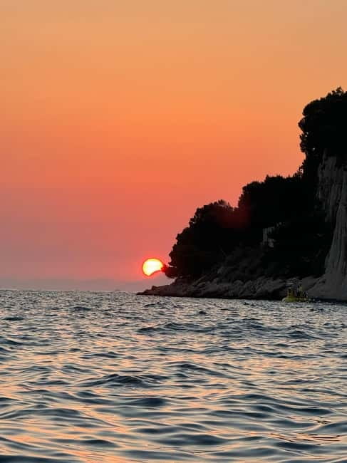Makarska: Sunset private boat tour from Makarska - Mid-sea sunset photo stop in front of Makarska