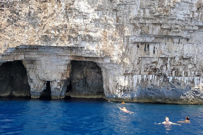 Private Blue Cave and Hvar - 5 Islands Tour - Budihovac Island: Sand-Bottom Swimming and a Beach Bar Moment