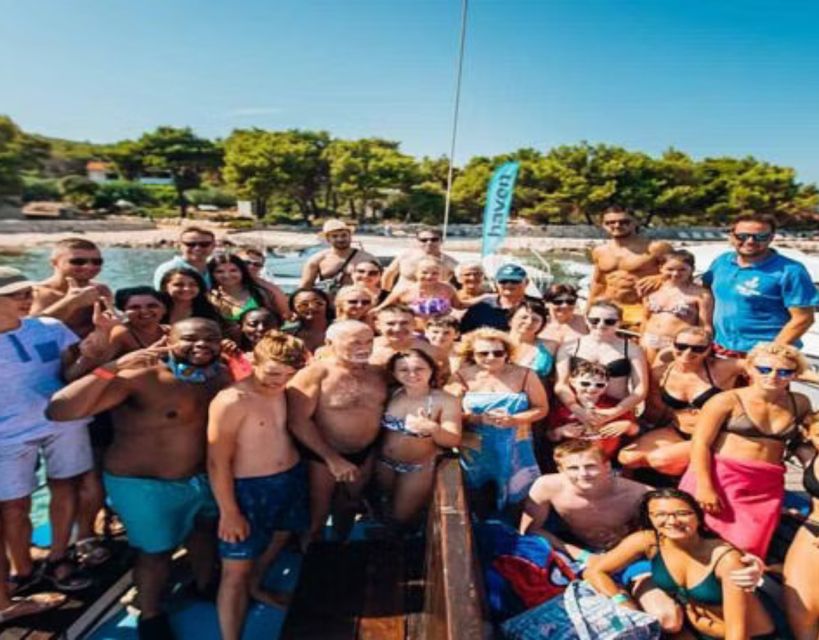 Split: Blue Lagoon Boat Trip with Lunch, Wine and Snorkeling - The onboard party deck, chill music, and the giant slide