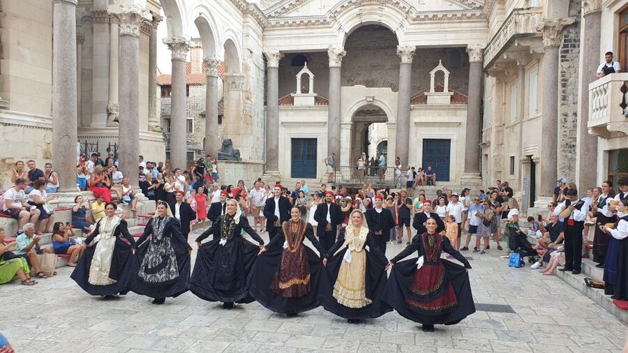 Split: History and Heritage Walking Tour - Walking into the UNESCO palace complex, where Rome becomes street life