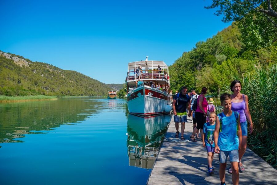 Split: Krka Waterfalls Trip with Boat Cruise and Swimming - Getting out of Split: bus time, comfort, and coastal scenery