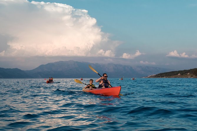 Sunset Kayaking - Paddling west along Brac’s pine, olive, and rocky coast